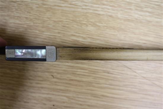 A violin bow by August Edwin Prager, nickel-mounted, stamped, L 74.5cm, 56gr